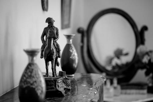 a statue of a man on a horse on a table at Le Rossay in Saint-Clément-de-la-Place