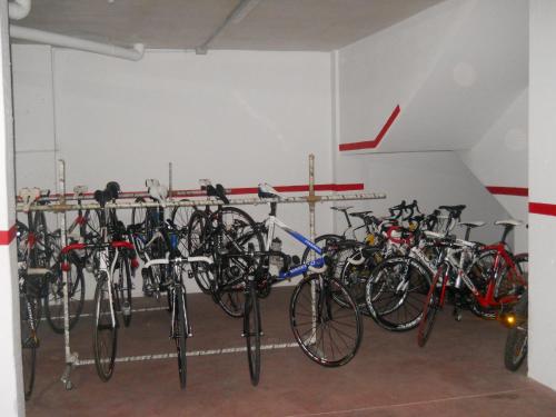 a bunch of bikes parked in a garage at Hostal Sant Bernat in Olot
