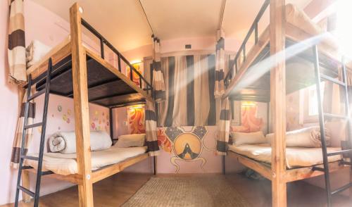 a bunk bed room with two bunk beds at Wander Thirst in Kathmandu