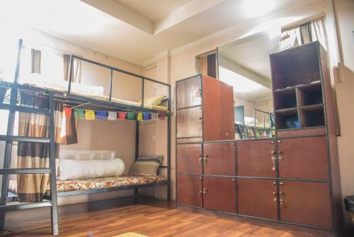 a room with two bunk beds and a bed at Wander Thirst in Kathmandu