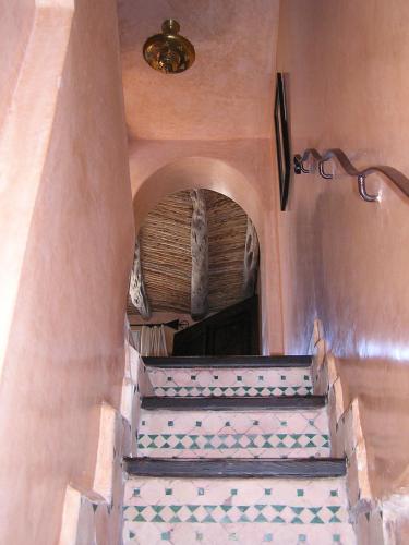 a stairway in a building with an archway at Dar Al Bahar in Essaouira