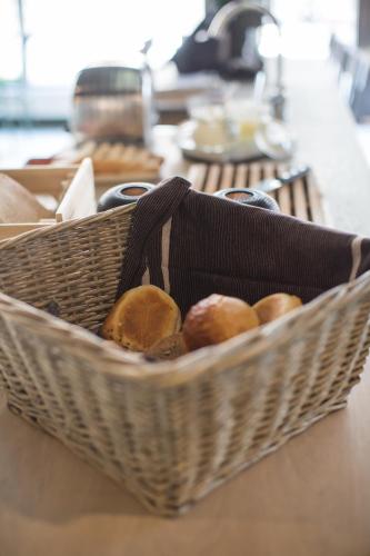 a basket of bread sitting on top of a counter at Best Western Plus Hus 57 in Ängelholm