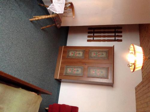 a room with two framed pictures on the wall at Naturgut Gailtal in Sankt Stefan an der Gail