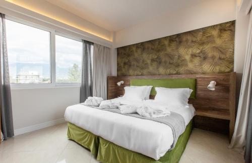 Postel nebo postele na pokoji v ubytování Garden City Resort