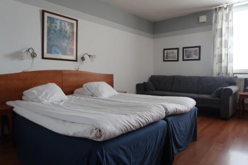 Una cama o camas en una habitación de Hotel Aveny Bed & Breakfast