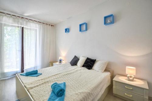 Postel nebo postele na pokoji v ubytování The Big Smile Apartments