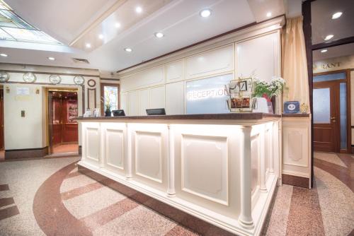 a large kitchen with a counter in a room at Hotel Downtown in Sofia