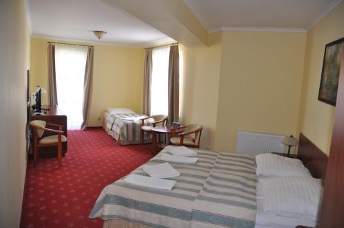 Ένα ή περισσότερα κρεβάτια σε δωμάτιο στο Hotel Morze