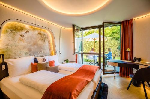 Postel nebo postele na pokoji v ubytování Hotel Neues Tor