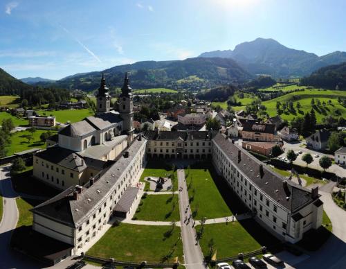 an aerial view of a castle with mountains in the background at JUFA Hotel Spital am Pyhrn in Spital am Pyhrn