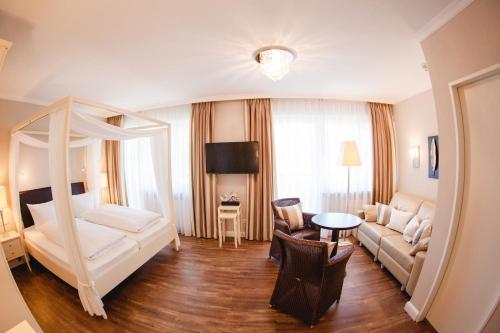 Гостиная зона в HIRSCH1783 Hotel LANDHAUS