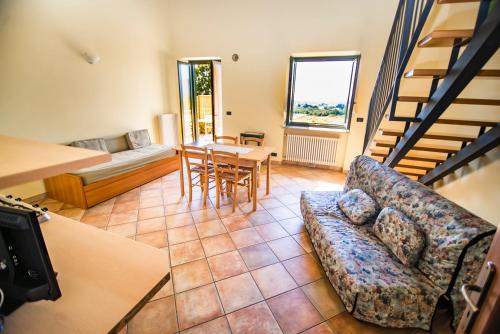 a living room with a couch and a table at Agriturismo Turina in Bricherasio