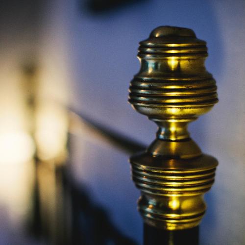 a close up of a gold pole with a blurry at Rum Doodle, Windermere B&B in Windermere