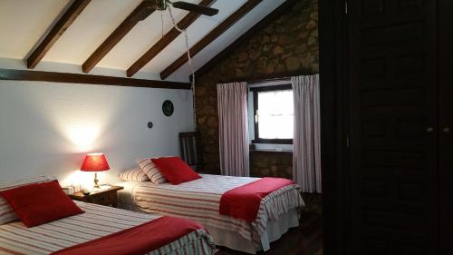 Säng eller sängar i ett rum på Mies de Villa
