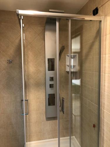 a shower with a glass door in a bathroom at Hotel Continental in Reggio Calabria