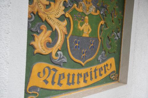 a painting of a crest with a woman on it at Ferienhof Nasnergut in Radstadt