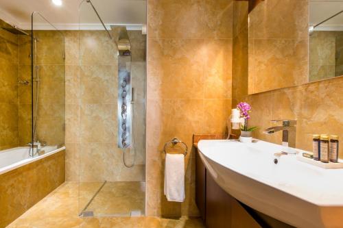 a bathroom with a sink and a shower at BURJ ON BAY Hotel in Jounieh