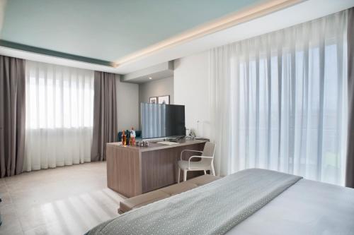TV a/nebo společenská místnost v ubytování Modica Beach Resort