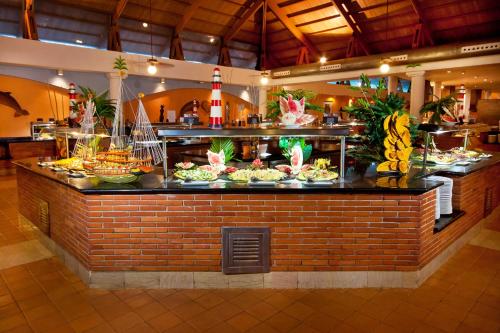 a buffet line with many plates of food at Catalonia Punta Cana - All Inclusive in Punta Cana