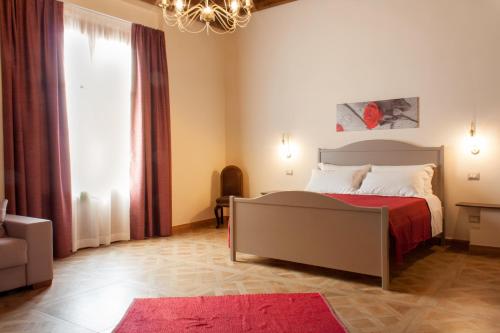 Case Vacanze Al Duomo tesisinde bir odada yatak veya yataklar