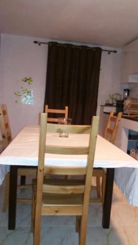 a dining room table with chairs and a table and a window at Taza Organic Garden with view park and restaurant in Taza