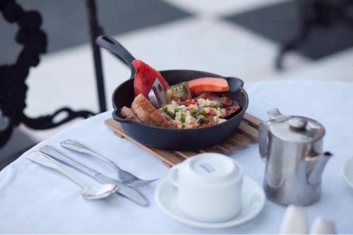 a bowl of food sitting on a table at Jamaica Palace Hotel in Port Antonio