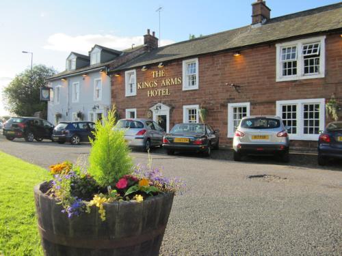 a building with a flower pot in front of it at The Kings Arms Temple Sowerby in Temple Sowerby