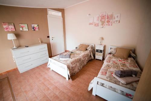 Ένα ή περισσότερα κρεβάτια σε δωμάτιο στο Ambrosia