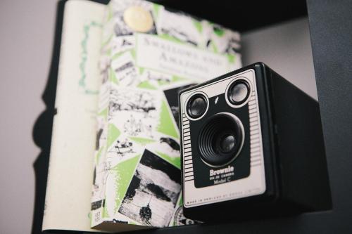 a camera is sitting on top of a book at Rum Doodle, Windermere B&B in Windermere