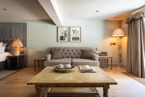 a living room with a couch and a coffee table at The Frogmill Hotel in Cheltenham