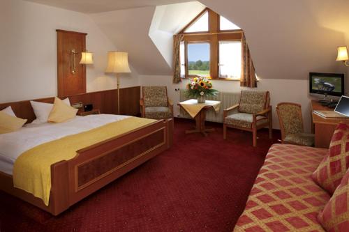 Postel nebo postele na pokoji v ubytování Hotel Drei Konige