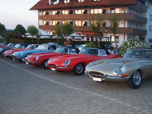 a row of old cars parked in a parking lot at Hotel Drei Konige in Schramberg