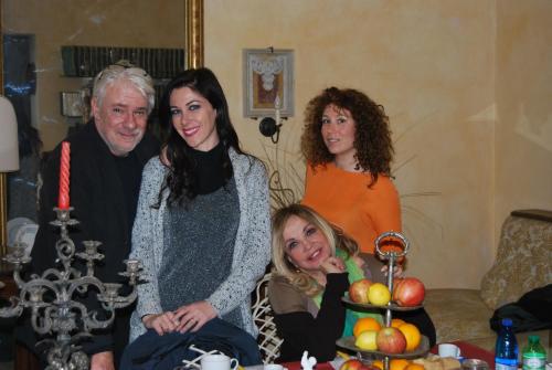 a family posing for a picture in a living room at B&B Palazzo de Matteis in San Severo