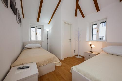 Postel nebo postele na pokoji v ubytování Apartman Mare