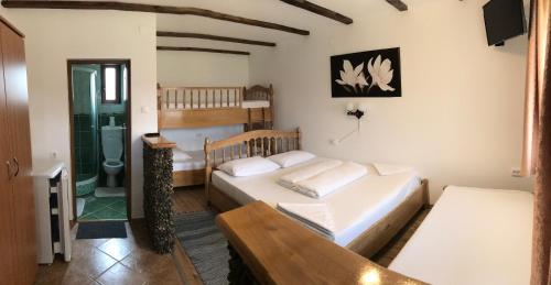 Ένα ή περισσότερα κρεβάτια σε δωμάτιο στο Patakmenti Panzió Spa