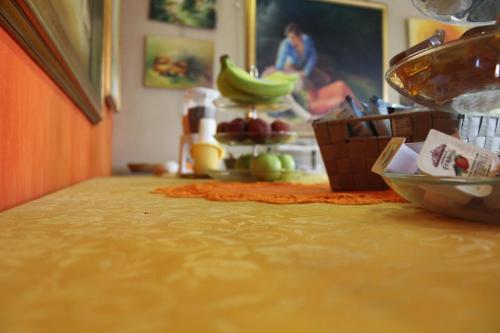 a counter top with a bunch of bananas on a table at Hotel Diana in Cassino