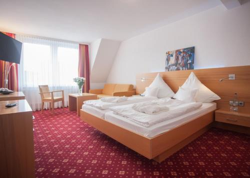 Een bed of bedden in een kamer bij Hotel Hessenhof