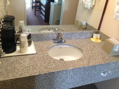 a bathroom counter with a sink in a hotel room at Days Inn by Wyndham Santa Fe New Mexico in Santa Fe