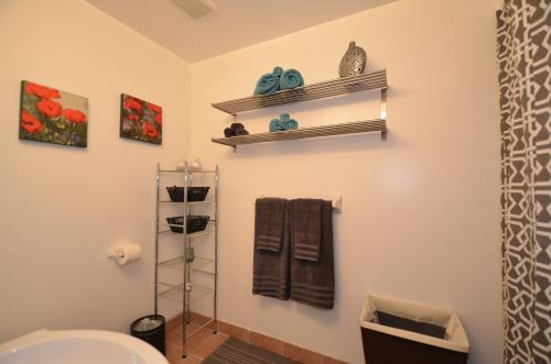 a bathroom with a toilet and a sink at The SoMa Furnished Residences in Hamilton
