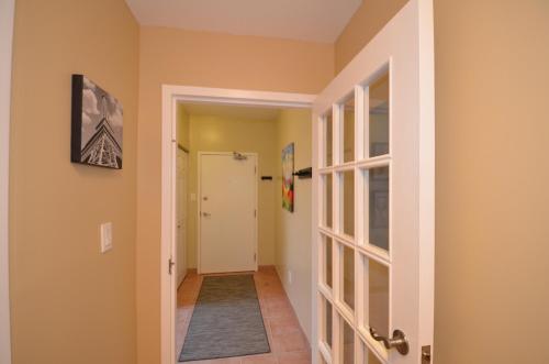 a hallway with a door leading into a room at The SoMa Furnished Residences in Hamilton