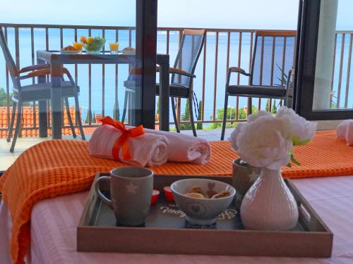 a tray of food on a table with a plate of food at Apartments La Perla in Mlini