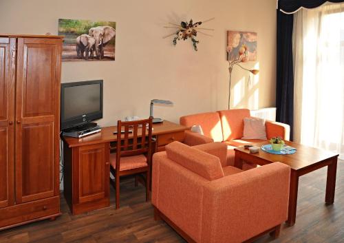 TV a/nebo společenská místnost v ubytování Hotel U Radnice