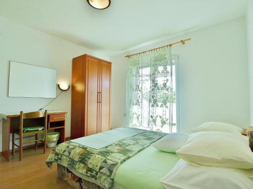 מיטה או מיטות בחדר ב-Dada Apartments