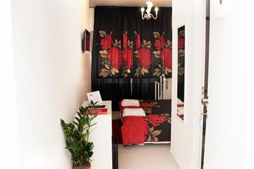 a door leading to a room with a black and red curtain at Rome Sweet Home Vatican in Rome