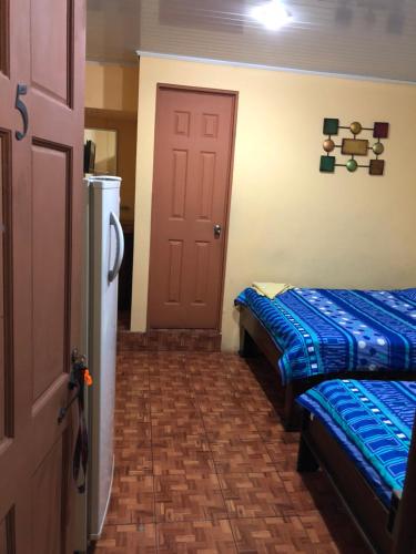 Ένα ή περισσότερα κρεβάτια σε δωμάτιο στο Cabinas Yolymar