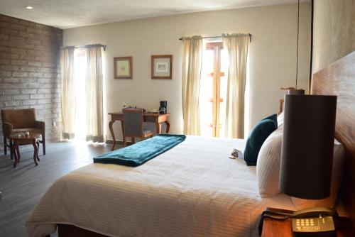 Postel nebo postele na pokoji v ubytování Hotel Casa Andaria
