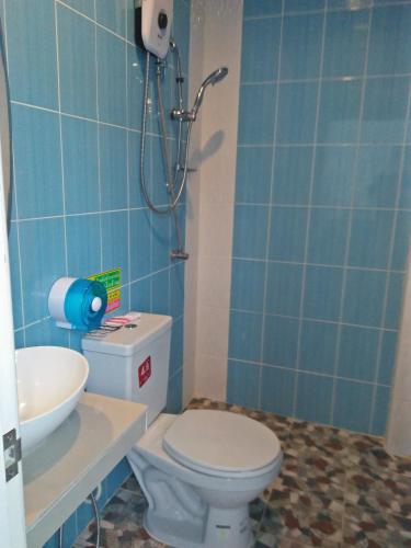 a bathroom with a toilet and a sink at Blue sky Koh larn Resort in Ko Larn