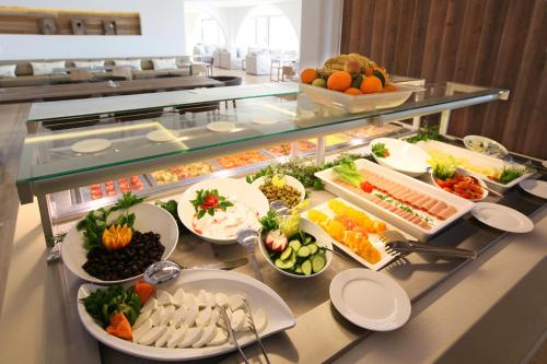 a buffet line with many different types of food at Droushia Heights Hotel in Droushia