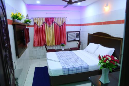 Hotel Garuda Gunturにあるベッド