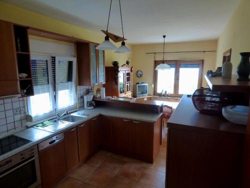 a kitchen with a sink and a counter top at Nestos, Meer und Berge - Griechenland mal anders in Zarkadhiá